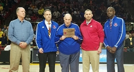 Charles Hudson receiving his service award from MPSSAA officials and State Basketball Committee.