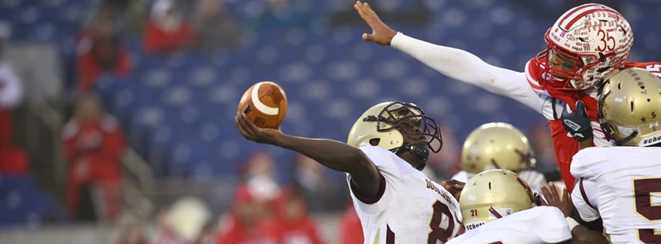 The Douglass-PG quarterback attempts a pass against Fort Hill in the Class 1A State Final.