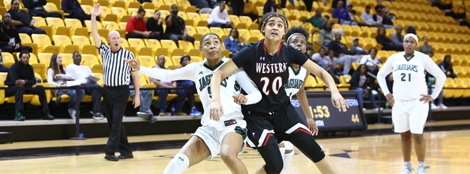 Opposing female players battle for rebounding position in the 2019 Class 4A State Semifinals.
