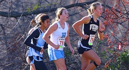 Several female runners power up the hill in the 2015 Class 3A state championship race.