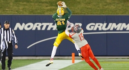 A Damascus receiver jumps to catch the football as a Franklin defender closes in during the 2016 State Finals.