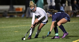A defender applies defensive pressure to the attacker with the ball during the 2017 State Field Hockey Tournament.