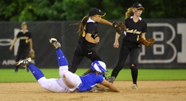In the 2017 2A State Softball Final, a North Caroline baserunner dives headfirst back into second base avoiding the put out by the South Carroll infielders.