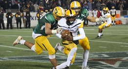 A Gwynn Park receiver protects the ball while running from the Damascus defenders in the 2017 Class 2A State Final.