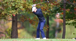 A male golfer tees off at the 2015 State Golf Tournament.