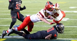 A Quince Orchard player dives over the goal line for a touchdown against North Point in the 2018 Class 4A Final.