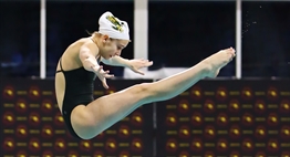 A female diver holds a pike position in perfect form while diving at the 2019 State Championships.