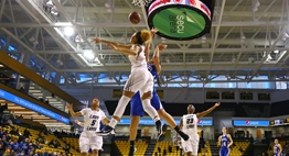 A female Largo basketball player blocks the shot of an opposing Williamsport player in the 2016 2A Final.