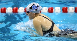 A female swimmer from Huntingtown HS swims breaststroke in the 2016 State Championships. 