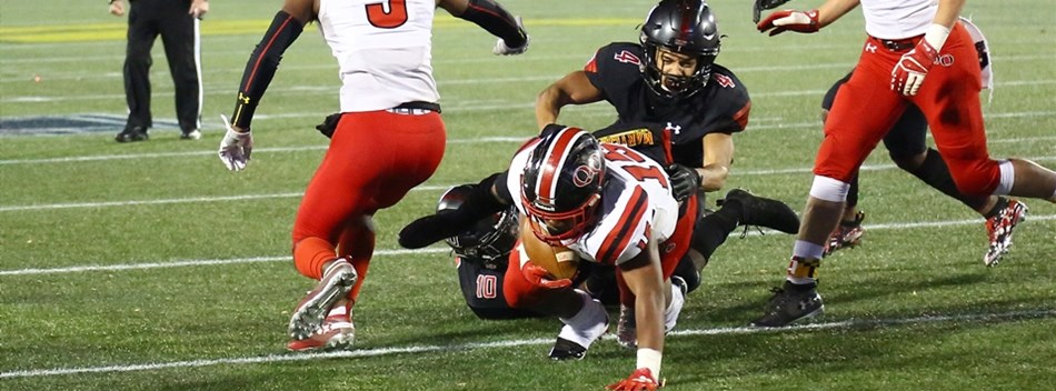 North Point defenders tackle a Quince Orchard runner during the 2018 Class 4A State Final.