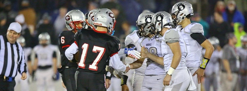 The Glenelg and Oakdale team captains shake hands before the 2018 Class 2A State Football Final.