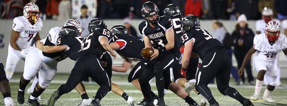 The Linganore quarterback hands off to a back against Franklin in the 2018 Class 3A State Final.