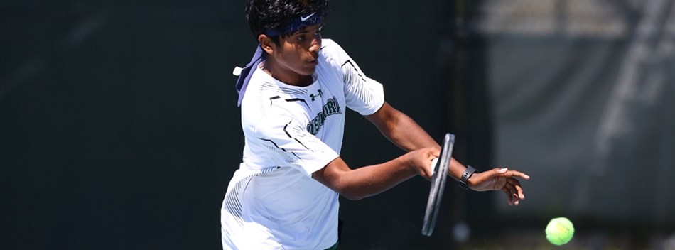 A male player focuses on hitting a return shot during the 2019 State Tennis Tournament.