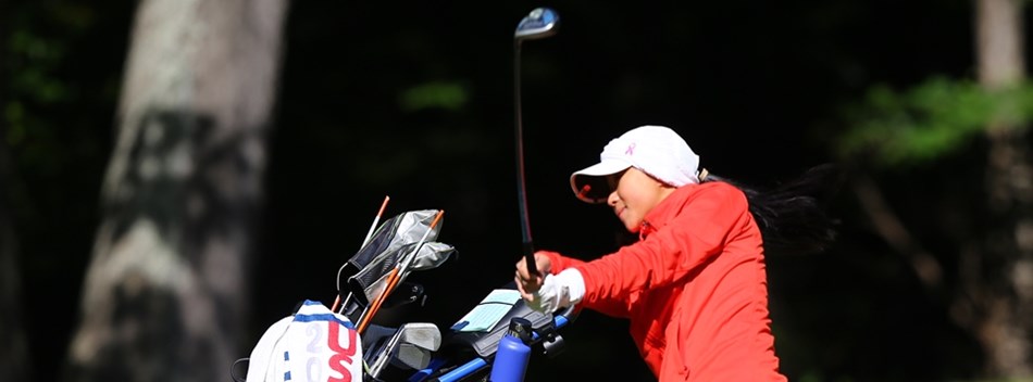 A female golfer hits a shot out of the fairway during the 2018 State Finals.